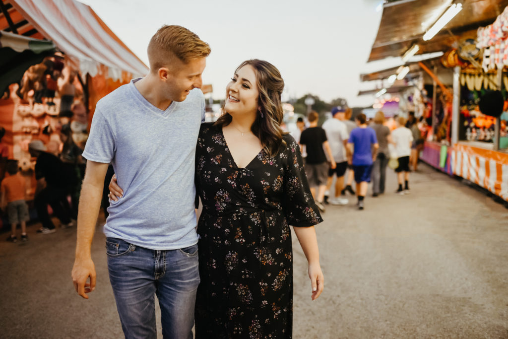 couple having fun at fall festival carnival