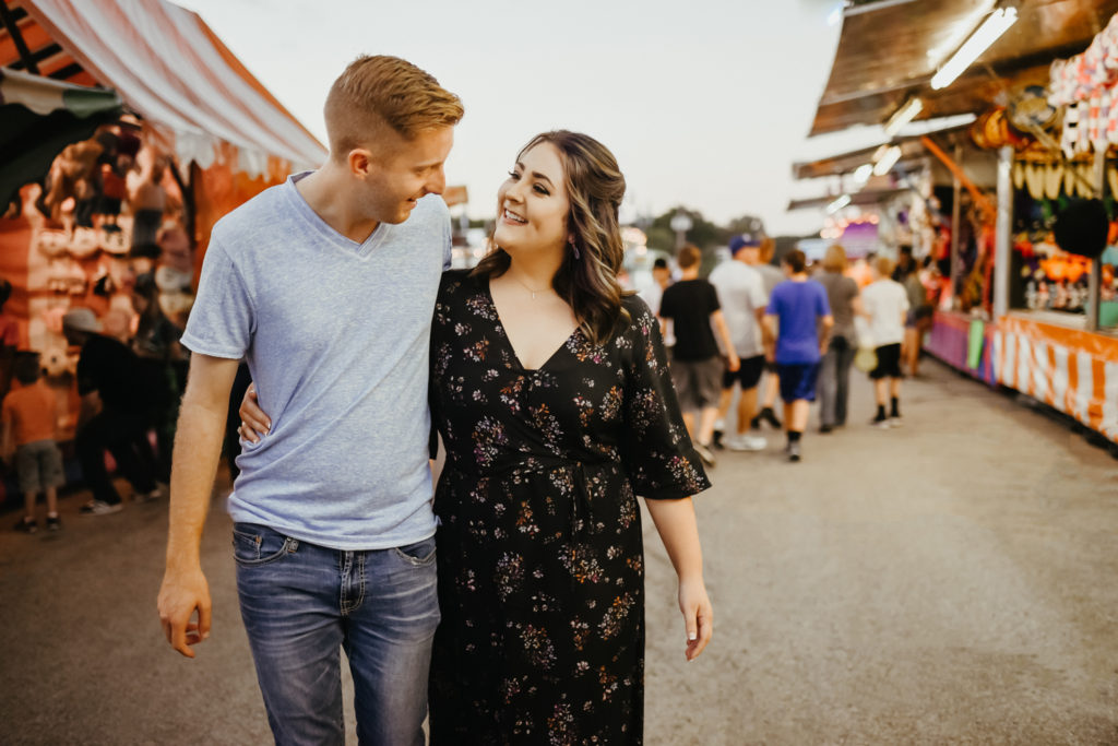 couple having fun at fall festival carnival