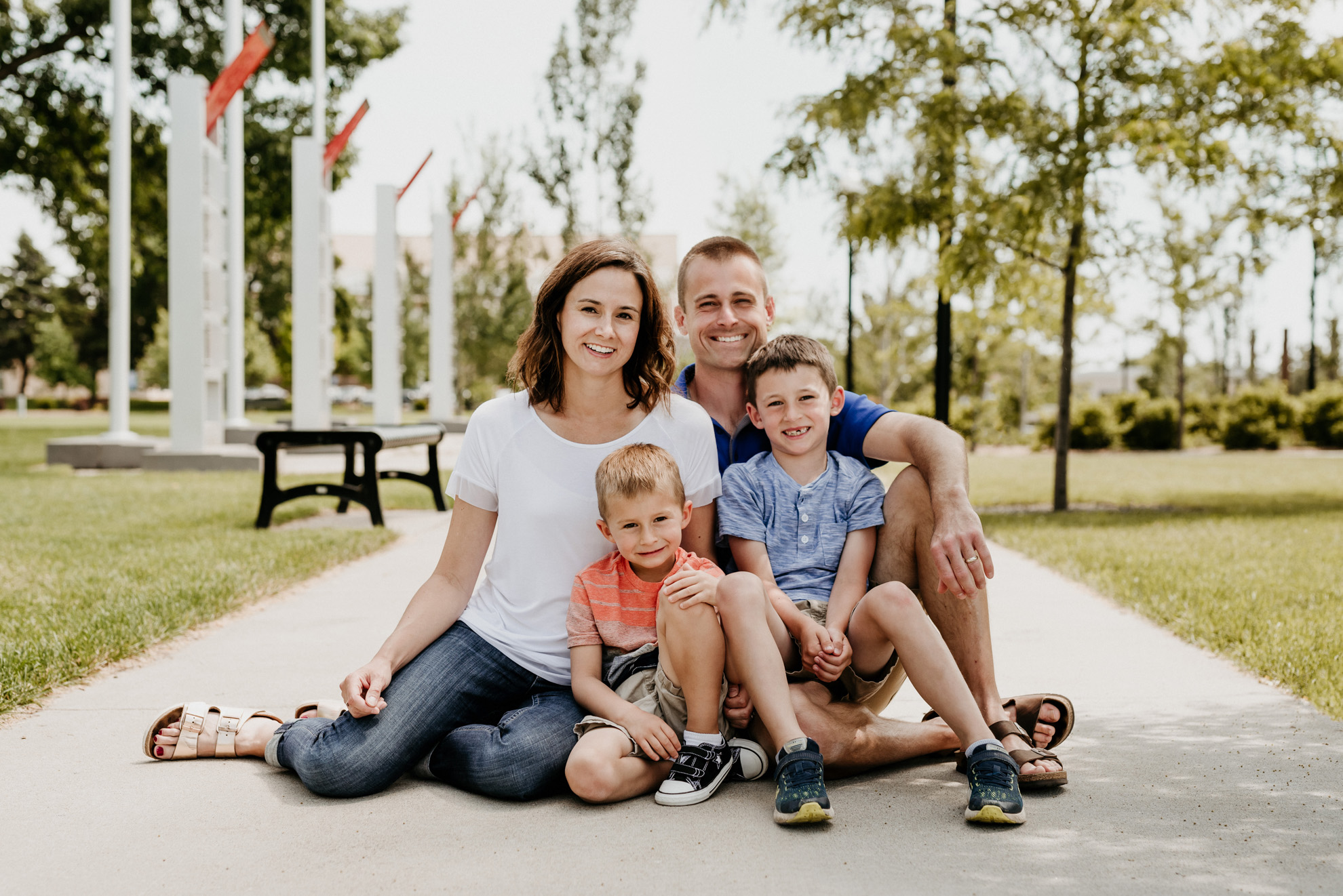 family photo of parents with two young boys