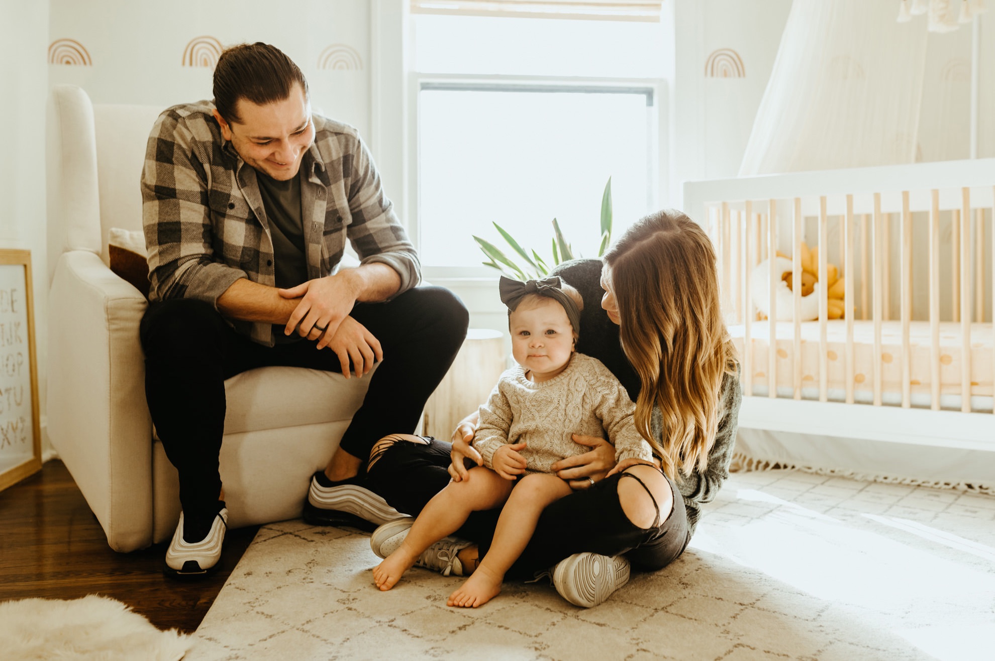 lifestyle family photo in home nursery